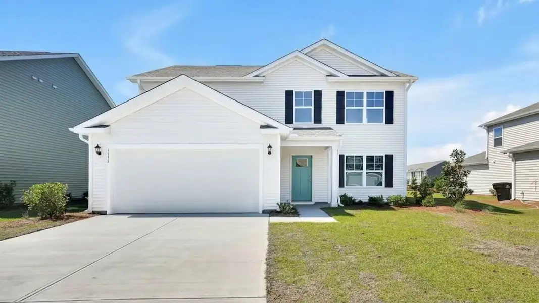 Front exterior of a new home in Sidbury Station, Castle Hayne, NC, highlighting curb appeal (Image 1). Front exterior of a new home in Sidbury Station, Castle Hayne, NC, highlighting curb appeal (Image 1).
