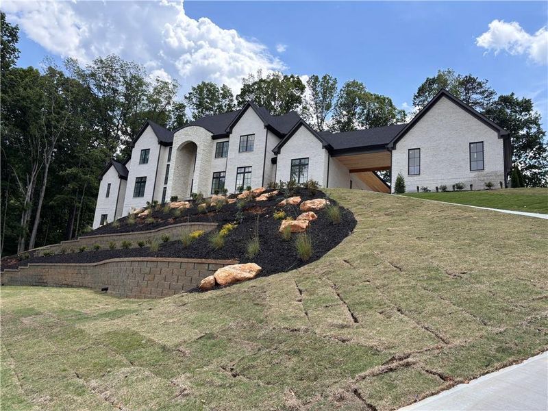 Front exterior of a new home in , Alpharetta, GA, highlighting curb appeal (Image 14).