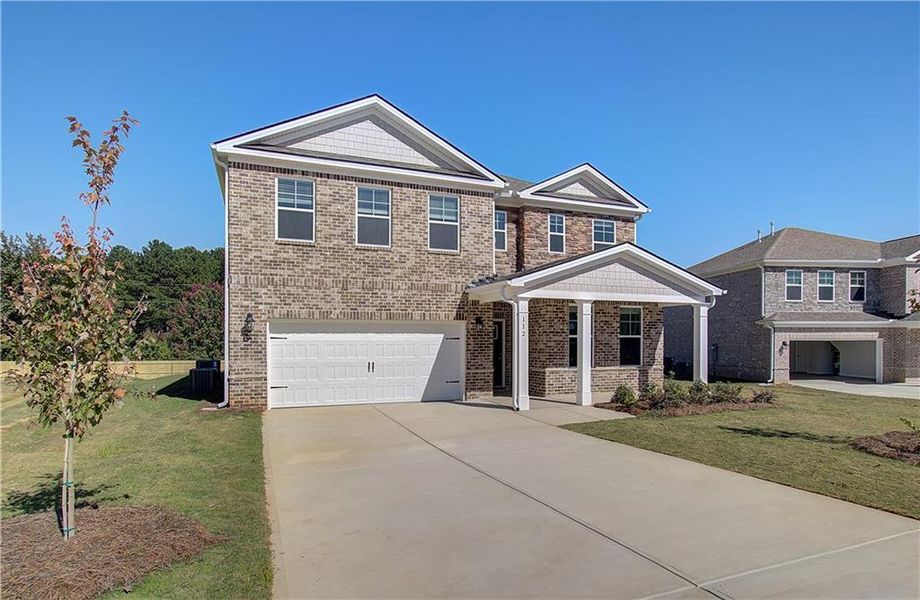 Front exterior of a new home in Burchwood, Stockbridge, GA, highlighting curb appeal (Image 18).