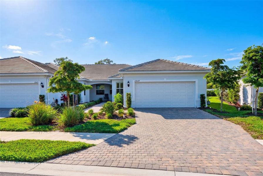 Front exterior of a new home in , Englewood, FL, highlighting curb appeal (Image 26).