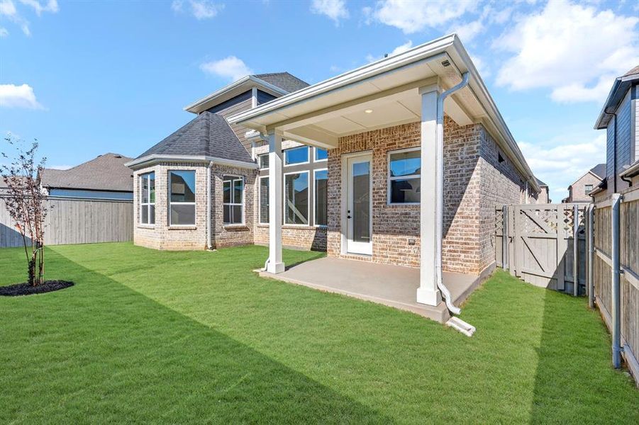 Exterior details and patio area of a home in Pecan Square - Gardens, Northlake (Image 3). Exterior details and patio area of a home in Pecan Square - Gardens, Northlake (Image 3).