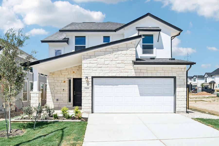 Front exterior of a new home in Foxfield, Austin, TX, highlighting curb appeal (Image 1). Front exterior of a new home in Foxfield, Austin, TX, highlighting curb appeal (Image 1).
