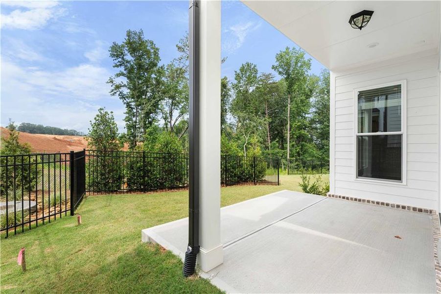 Front exterior of a new home in Palisades Single Family, Cumming, GA, highlighting curb appeal (Image 30).