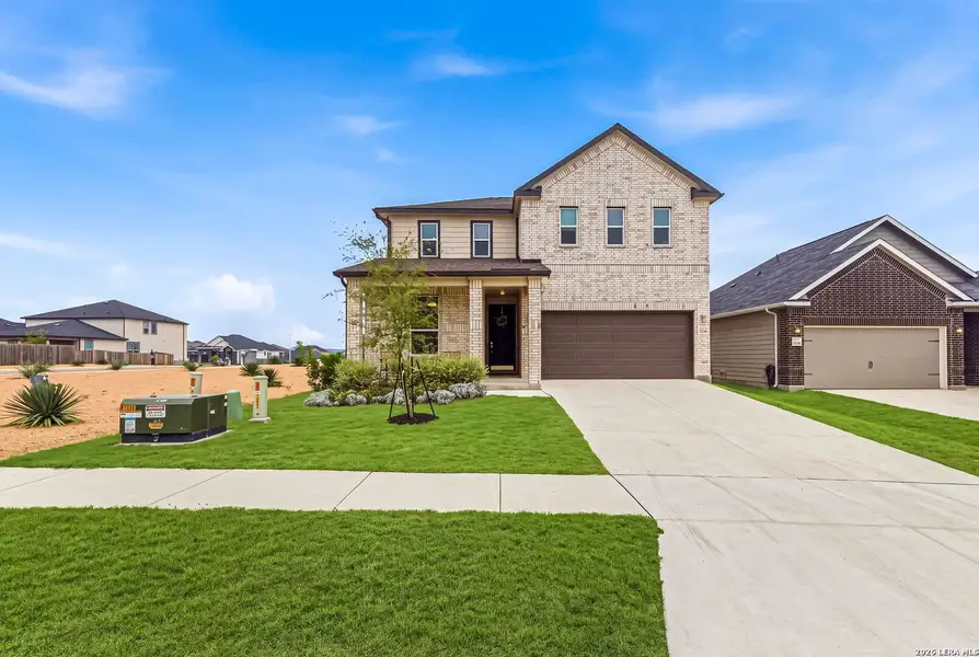 Front exterior of a new home in , Boerne, TX, highlighting curb appeal (Image 23). Front exterior of a new home in , Boerne, TX, highlighting curb appeal (Image 23).