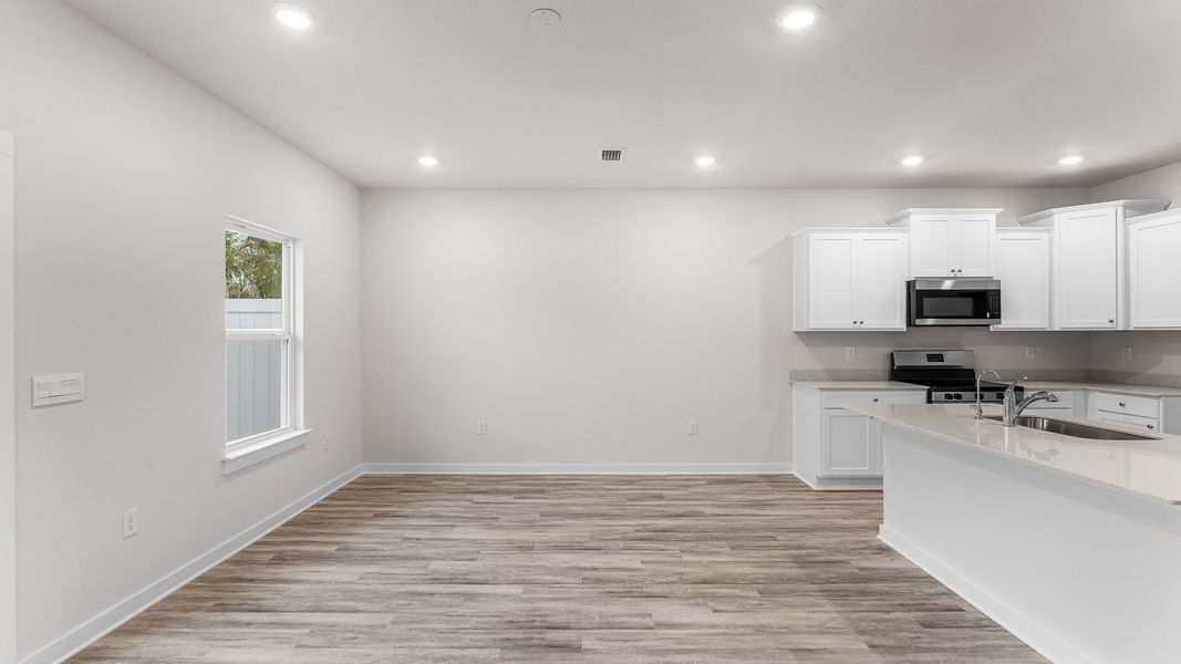 Image 28 representing the Palm Interior by D.R. Horton in Genoa Landing Townhomes, Freeport, FL.