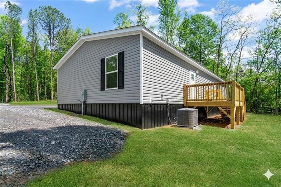 Exterior details and patio area of a home in , Ellijay (Image 27).