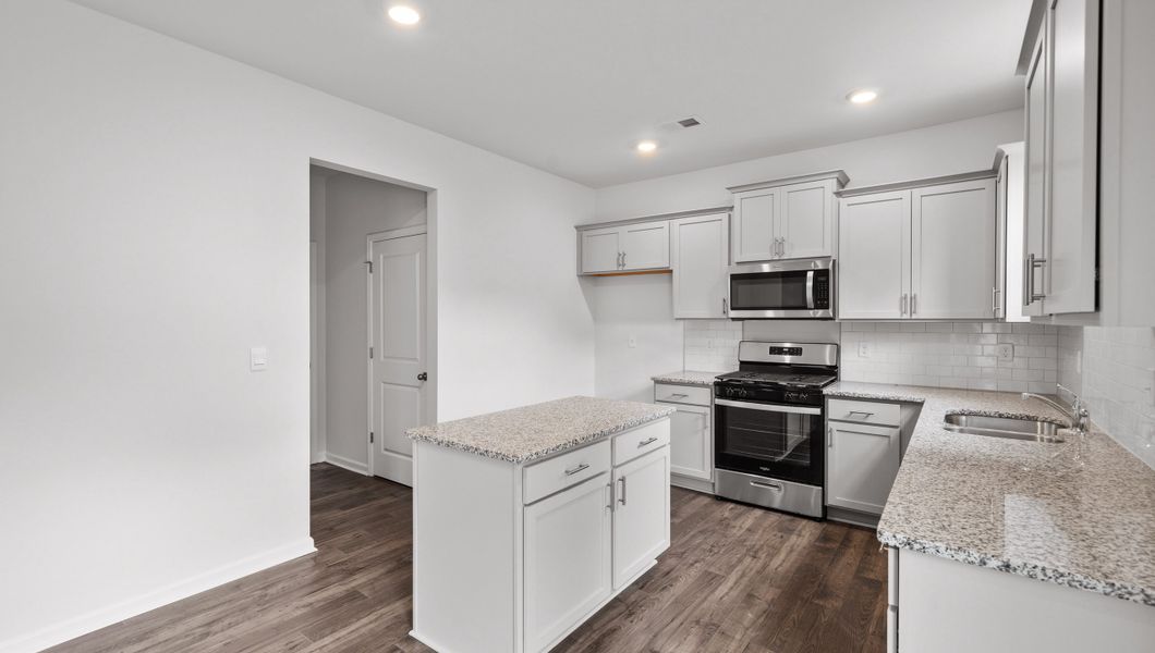 Representative furnished interior of a home built from the Biltmore by D.R. Horton in Woodglen, Piedmont (Image 7).