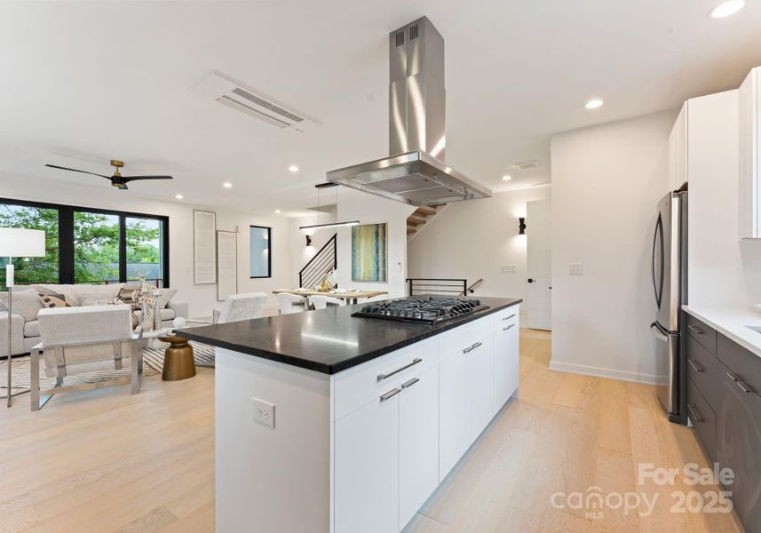 Walk-in pantry to the left of the fridge.