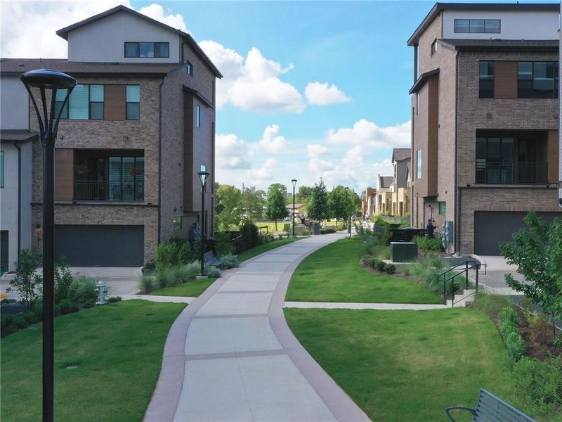Front exterior of a new home in The Grove, Austin, TX, highlighting curb appeal (Image 1). Front exterior of a new home in The Grove, Austin, TX, highlighting curb appeal (Image 1).