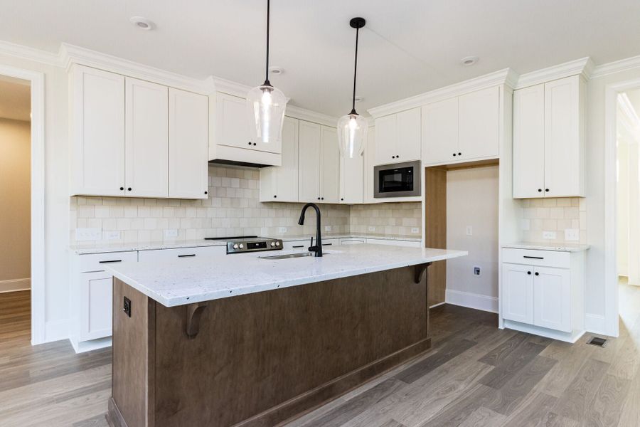 Representative furnished interior of a home built from the Essington Craftsman Foursquare by Homes by Dickerson in The View, Durham (Image 5).