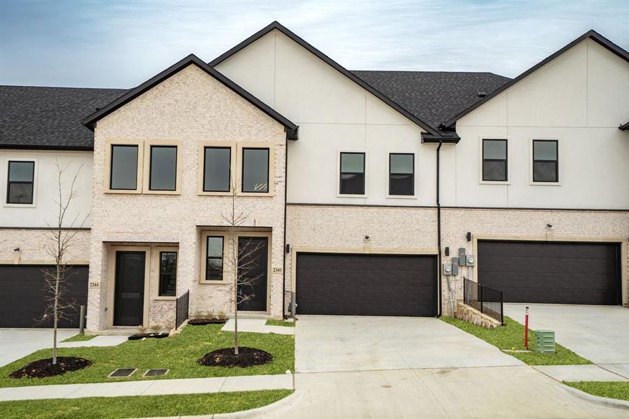 The color of the grass has been virtually enhanced to demonstrate what the home may look like in spring.