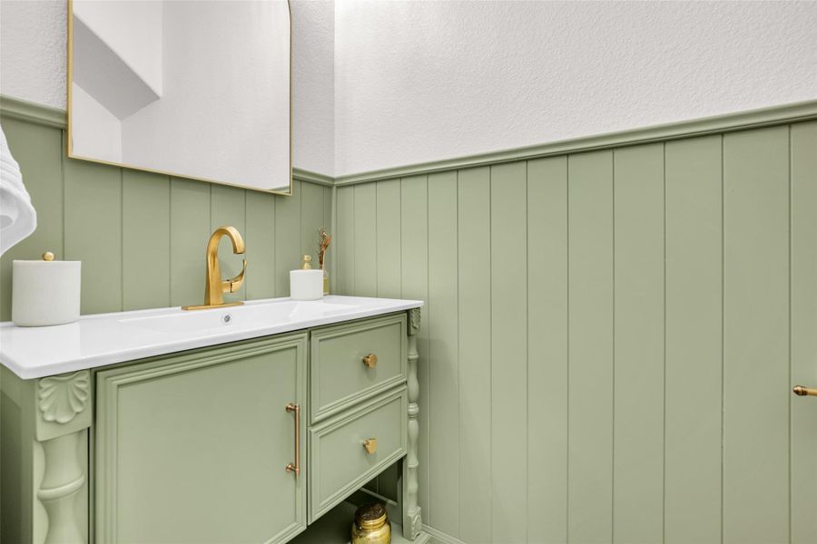 A conveniently located half bath on the first floor provides easy access for residents and guests, adding functionality to the main living level.