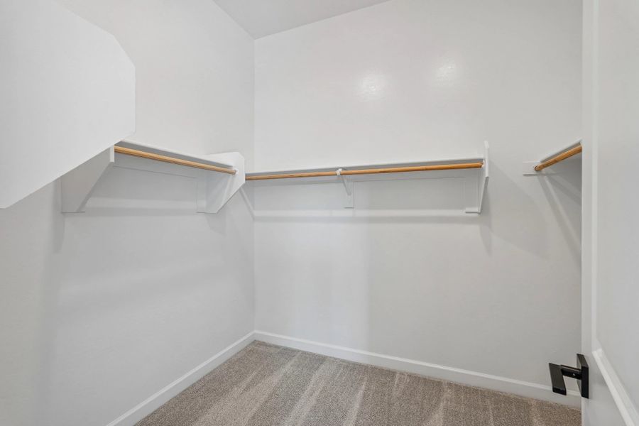 Primary walk in closet Primary walk in closet