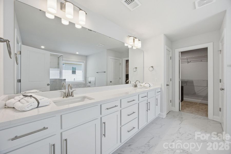 Primary bathroom with shower, tub, private water closet and walk in closet.