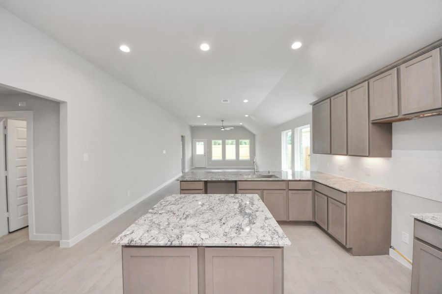 This generously spacious kitchen is a dream realized! Sample photo of completed home with similar floor plan. Actual colors and selections may vary.