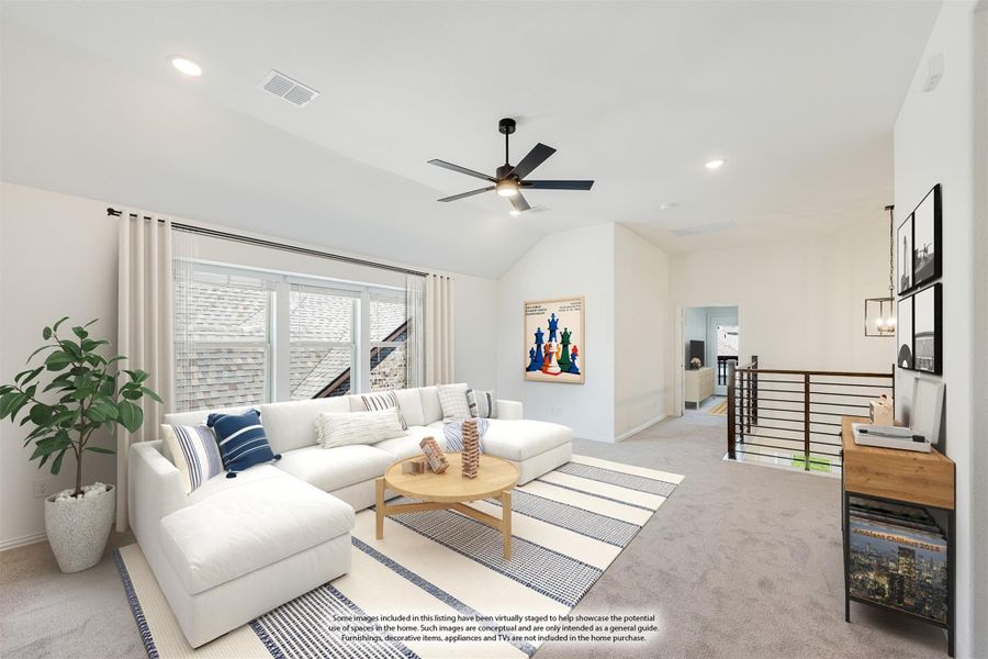 Upstairs loft living area with vaulted ceiling, ceiling fan, white sectional sofa, and open stair railing Upstairs loft living area with vaulted ceiling, ceiling fan, white sectional sofa, and open stair railing
