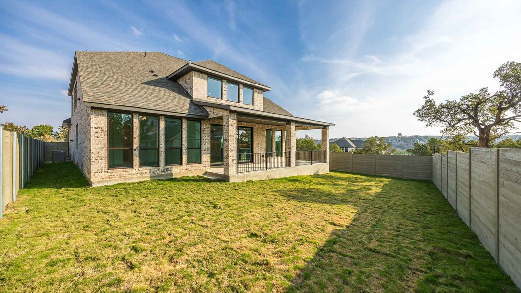 Exterior details and patio area of a home in Wolf Ranch 56', Georgetown (Image 2).
