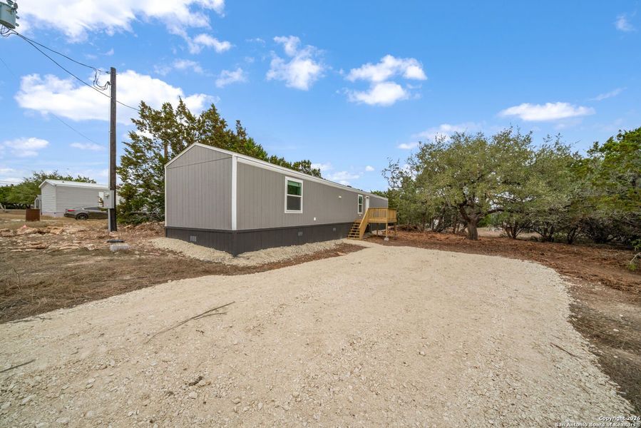 Exterior details and patio area of a home in , Bandera (Image 16).