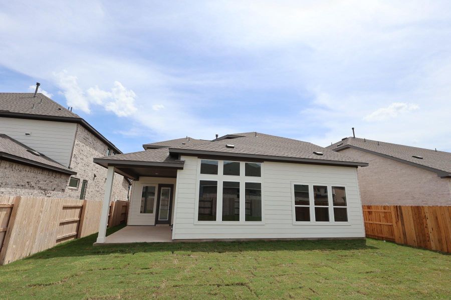 Front exterior of a new home in Homestead at Old Settlers Park, Round Rock, TX, highlighting curb appeal (Image 1).