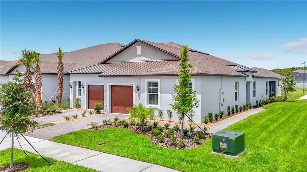 Front exterior of a new home in New Port Corners Active Adult, New Port Richey, FL, highlighting curb appeal (Image 1). Front exterior of a new home in New Port Corners Active Adult, New Port Richey, FL, highlighting curb appeal (Image 1).
