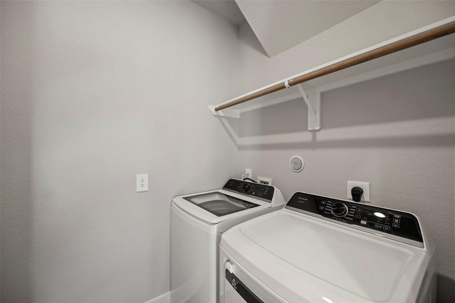 Convenient laundry room designed to simplify busy routines. Convenient laundry room designed to simplify busy routines.