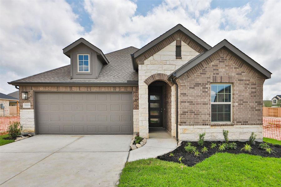Front exterior of a new home in Cypress Green, Hockley, TX, highlighting curb appeal (Image 2). Front exterior of a new home in Cypress Green, Hockley, TX, highlighting curb appeal (Image 2).