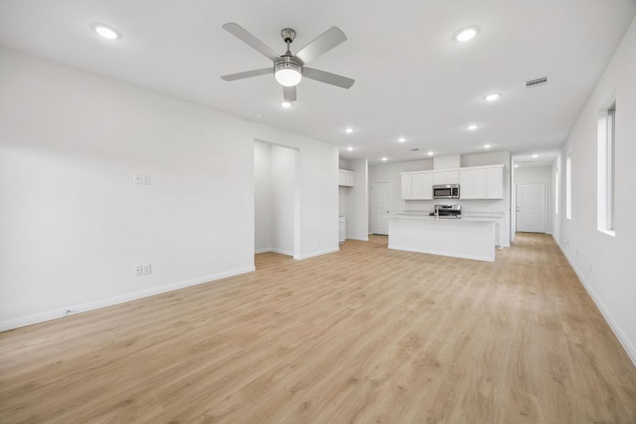 Dining and Living Areas in the Magnolia home plan by Trophy Signature Homes – REPRESENTATIVE PHOTO
