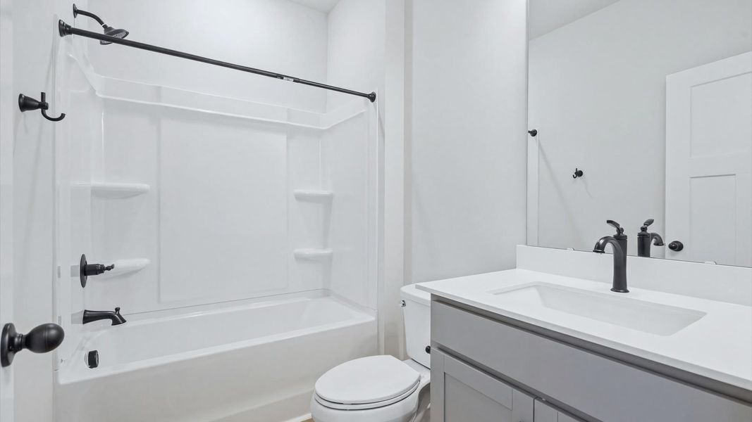 Top-notch bathroom with current fixtures, tasteful materials, and elevated charm at Creeks at Midway