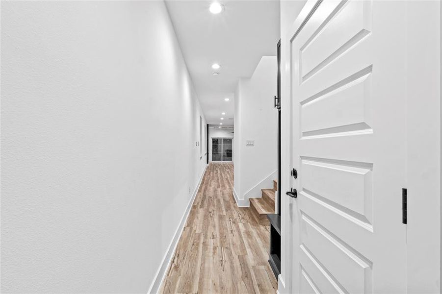 Hallway with light wood-type flooring