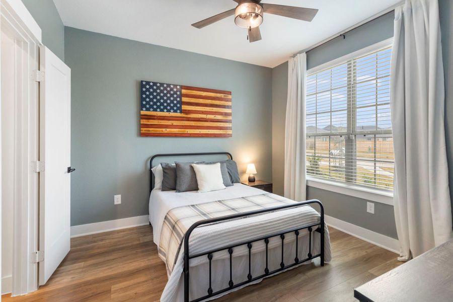 There are two downstairs bedrooms in this home.  This one is at the front of the house and has its own full bathroom.  Perfect as a guest suite or for an older child.