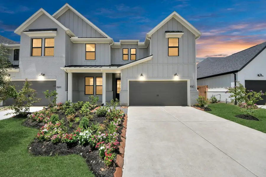 Front exterior of a new home in Bridgeland: Signature Collection, Cypress, TX, highlighting curb appeal (Image 1).