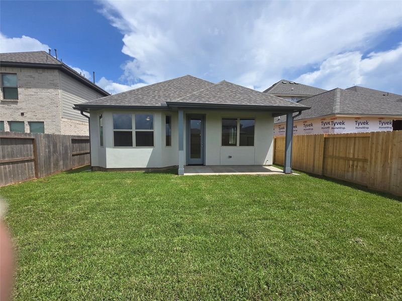 Front exterior of a new home in Sienna 40', Missouri City, TX, highlighting curb appeal (Image 1).