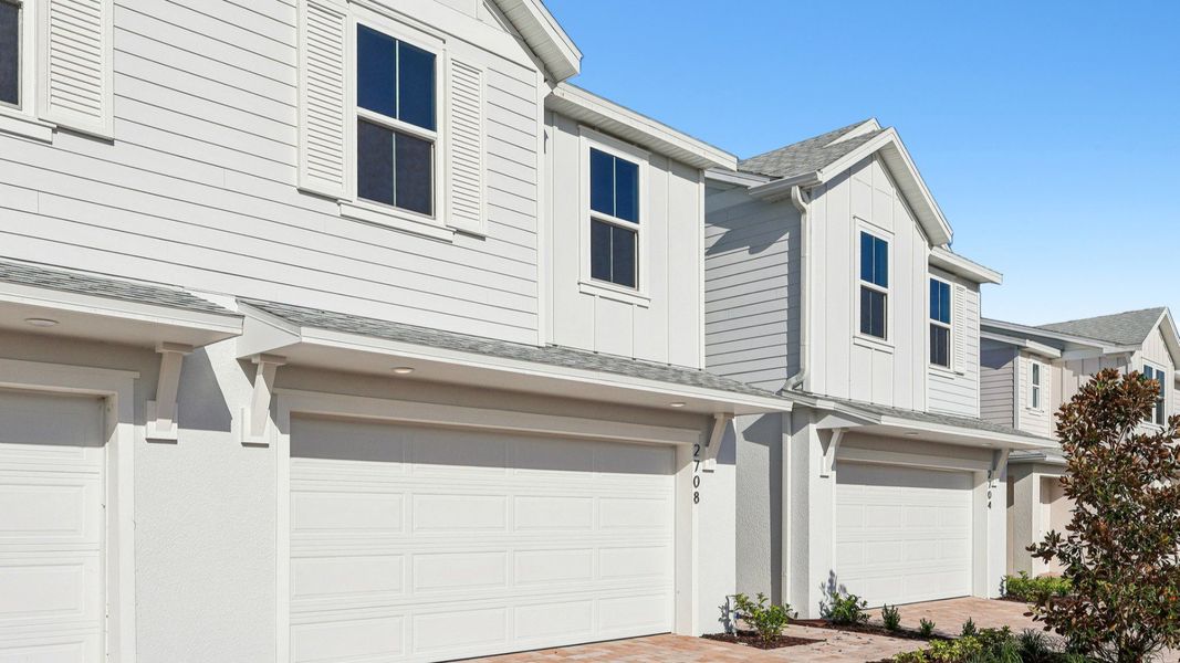 Front exterior of a new home in Cyrene at Harmony, St. Cloud, FL, highlighting curb appeal (Image 2).