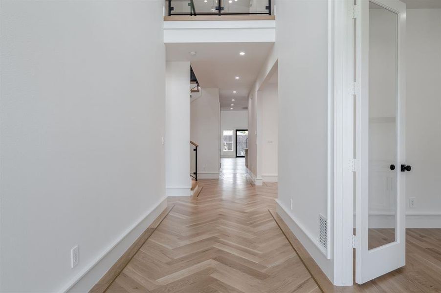 Corridor featuring recessed lighting and baseboards Corridor featuring recessed lighting and baseboards