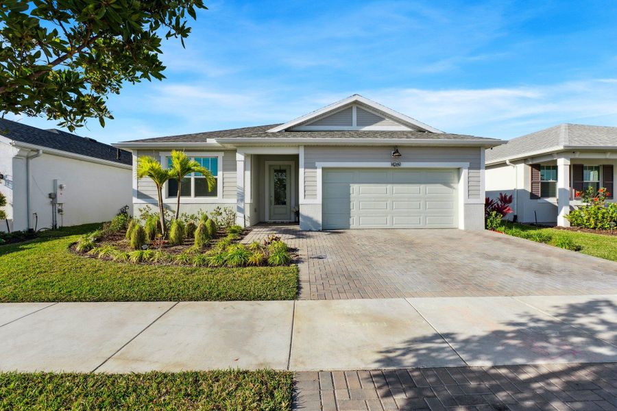 Front exterior of a new home in , Port St. Lucie, FL, highlighting curb appeal (Image 1). Front exterior of a new home in , Port St. Lucie, FL, highlighting curb appeal (Image 1).