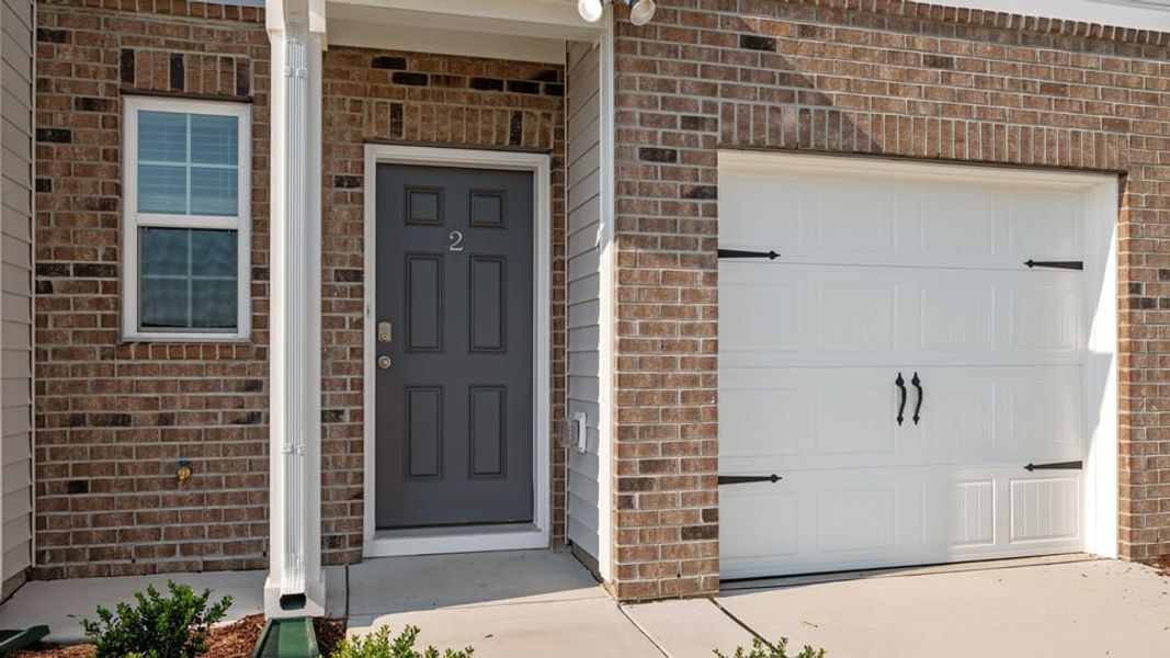 Exterior details and patio area of a home in The Townes at Ridgewood Farms, Winterville (Image 19).
