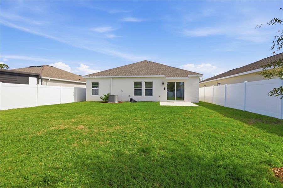 Exterior details and patio area of a home in Vineland Reserve, Osteen (Image 15).