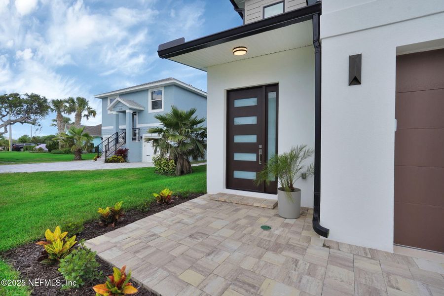 Front exterior of a new home in , Ormond Beach, FL, highlighting curb appeal (Image 1).