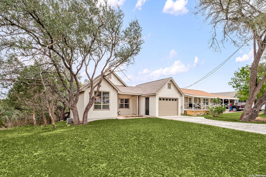 Front exterior of a new home in , Canyon Lake, TX, highlighting curb appeal (Image 29).