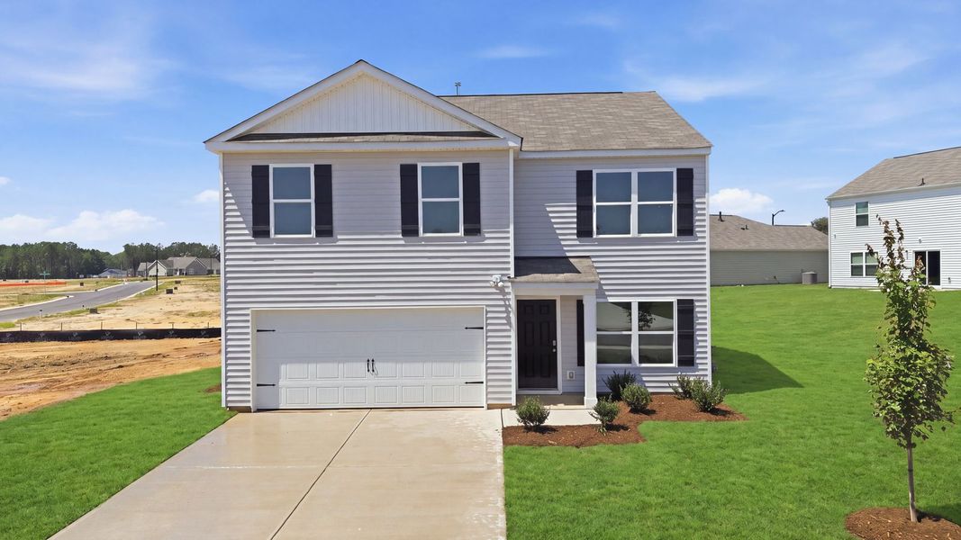 Front exterior of a new home in Hunter Hill, Rocky Mount, NC, highlighting curb appeal (Image 1). Front exterior of a new home in Hunter Hill, Rocky Mount, NC, highlighting curb appeal (Image 1).