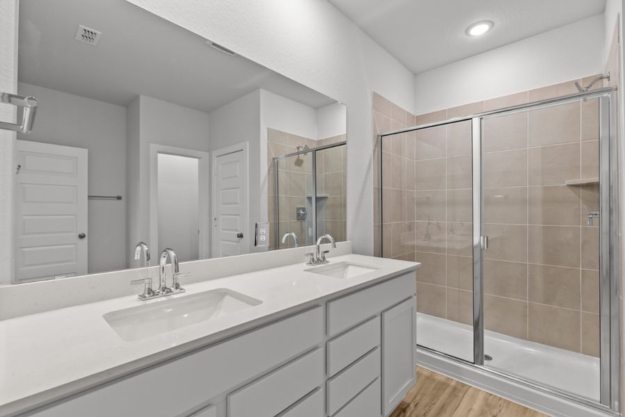 A bathroom with a glass shower.