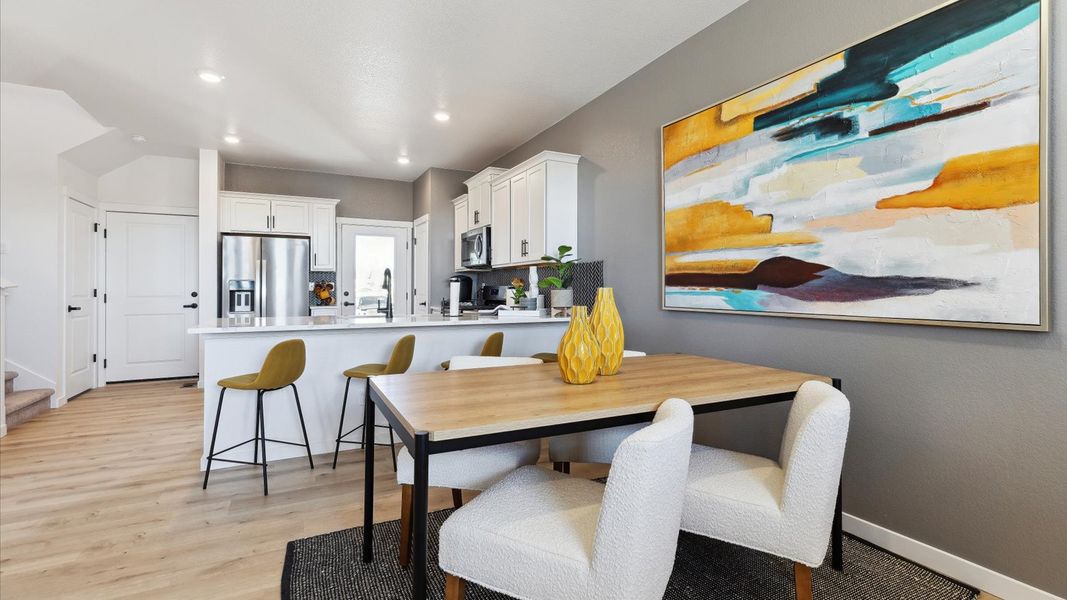 Representative furnished interior of a home built from the Larimer by D.R. Horton in Horizon Uptown, Aurora (Image 9).