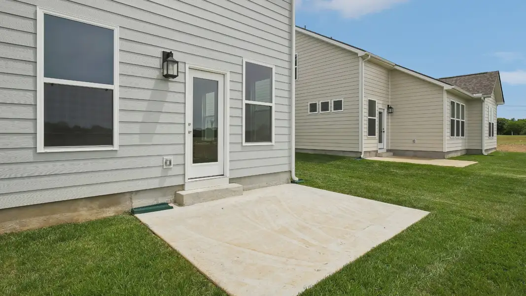 Large Backyard of home with small back patio Large Backyard of home with small back patio