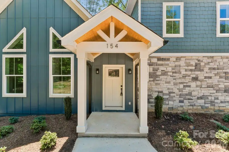 Exterior details and patio area of a home in , Troutman (Image 3).