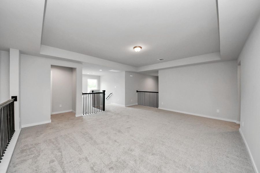 Come upstairs and enjoy a day of leisure in this fabulous game room! This is the perfect hangout spot or adult game room! Features plush carpet, high ceilings, custom paint and windows for plenty of natural light. Come upstairs and enjoy a day of leisure in this fabulous game room! This is the perfect hangout spot or adult game room! Features plush carpet, high ceilings, custom paint and windows for plenty of natural light.