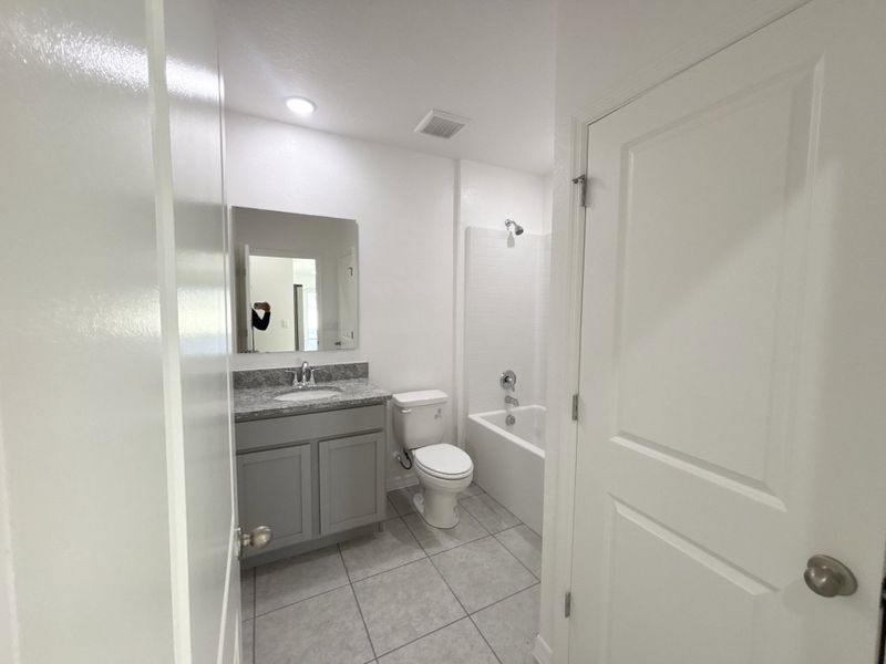 Furnished interior view inside a new home in Lake Deer Estates, Poinciana (Image 10).