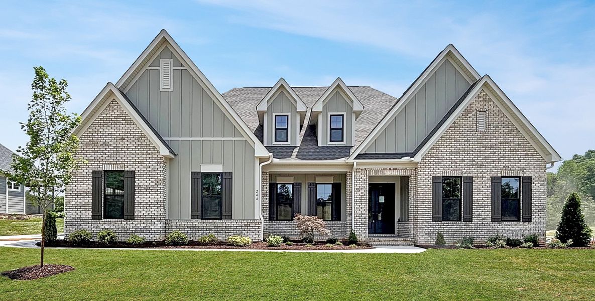 Front exterior of a new home in Cordera, Concord, NC, highlighting curb appeal (Image 1). Front exterior of a new home in Cordera, Concord, NC, highlighting curb appeal (Image 1).