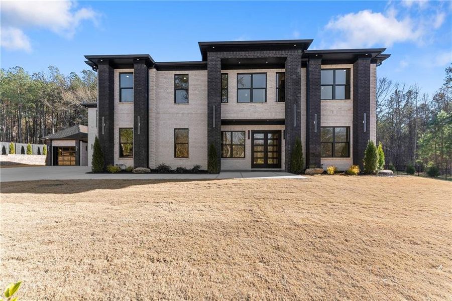 Front exterior of a new home in , Hoschton, GA, highlighting curb appeal (Image 36).