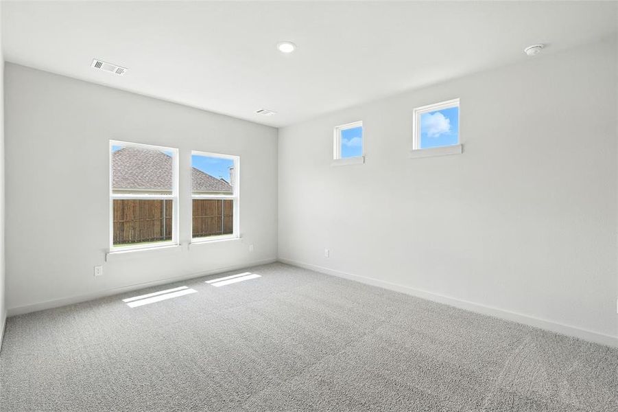 Spare room featuring carpet floors and recessed lighting Spare room featuring carpet floors and recessed lighting