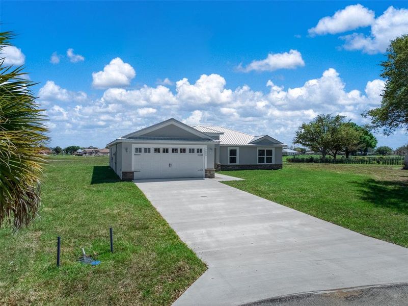 Front exterior of a new home in , Sebring, FL, highlighting curb appeal (Image 22).